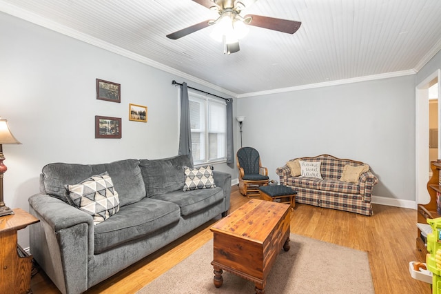 living room with ceiling fan, ornamental molding, and light hardwood / wood-style floors