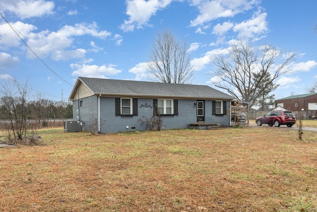 view of front of home with cooling unit and a front lawn