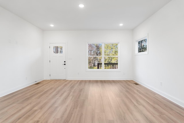 interior space featuring light hardwood / wood-style flooring and a healthy amount of sunlight