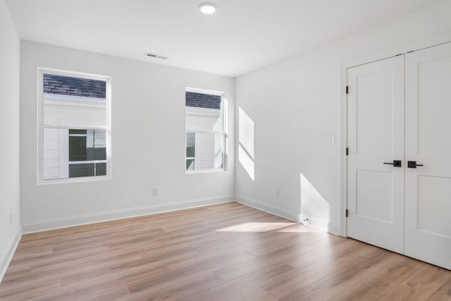 empty room featuring light hardwood / wood-style floors