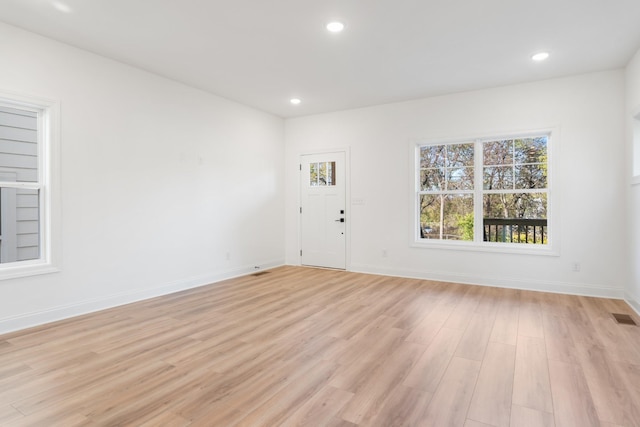 unfurnished room featuring light hardwood / wood-style flooring