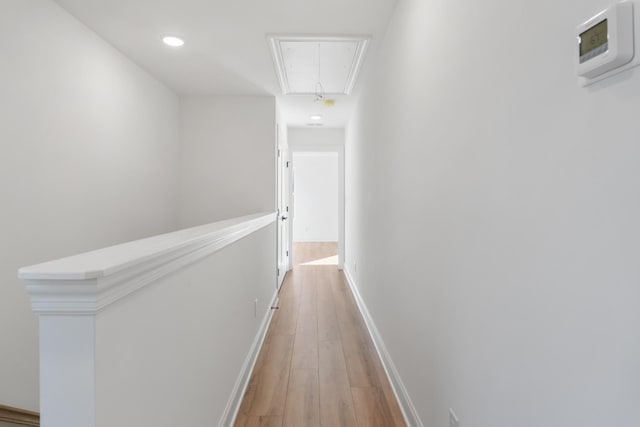 hall with hardwood / wood-style flooring