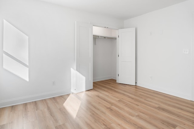 unfurnished bedroom featuring light wood-type flooring