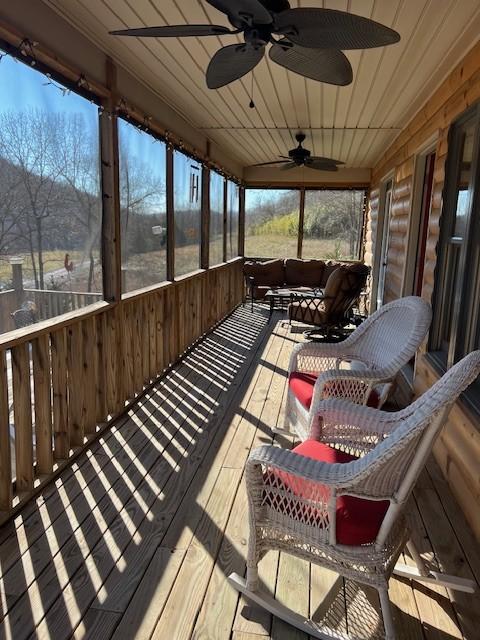 sunroom featuring wood ceiling