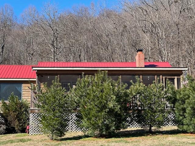 view of property exterior with a yard