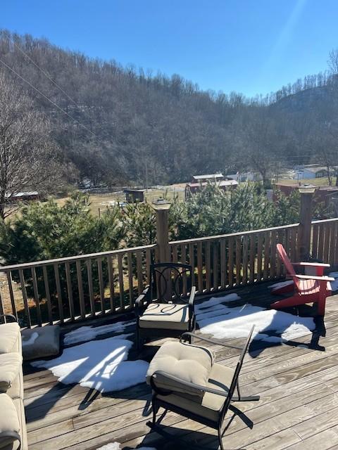 wooden terrace with a mountain view