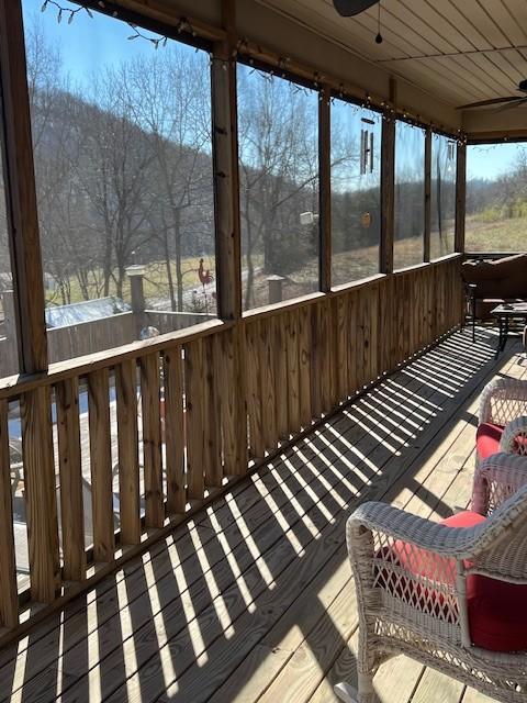 wooden terrace with ceiling fan