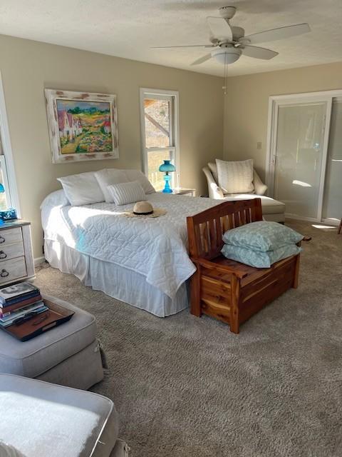 bedroom with ceiling fan and carpet