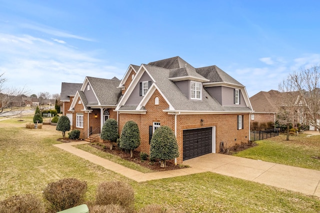 view of front of house featuring a garage and a front yard