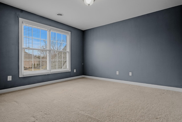 unfurnished room with carpet floors