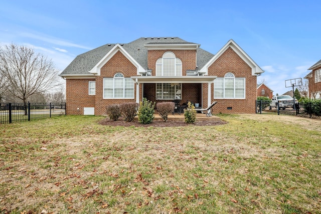 view of front of home with a patio and a front yard