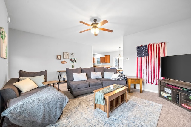 living room featuring light colored carpet and ceiling fan