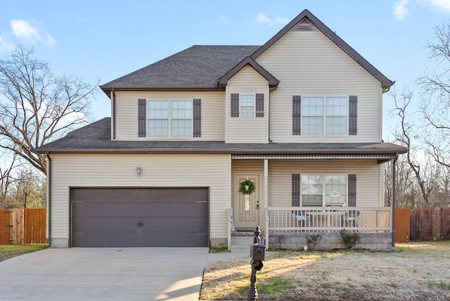 view of front of property featuring a garage and a porch