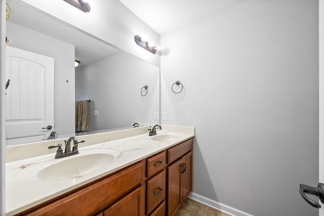 bathroom featuring tile patterned flooring and vanity