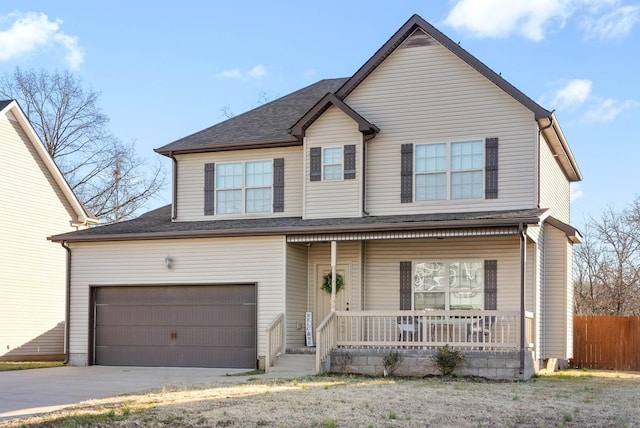 view of front property with a porch and a garage