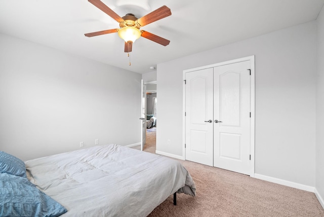 bedroom featuring ceiling fan, carpet floors, and a closet