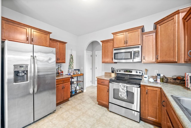 kitchen featuring appliances with stainless steel finishes and sink