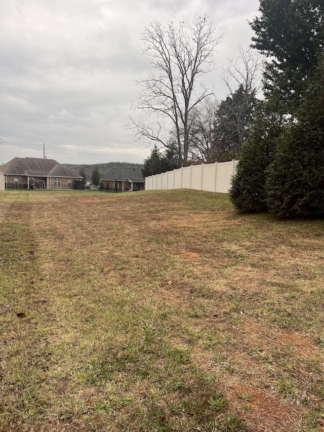 view of yard with fence