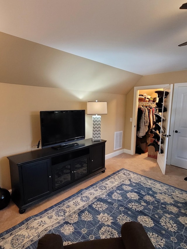 living room featuring vaulted ceiling and light colored carpet