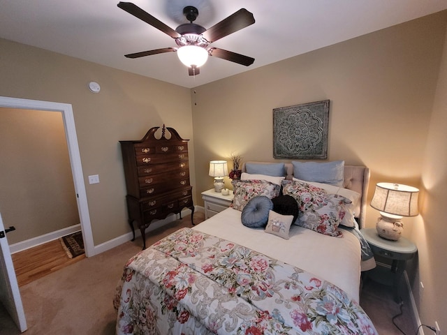 bedroom with light colored carpet and ceiling fan