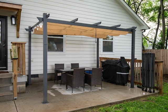 view of patio with a grill and a pergola