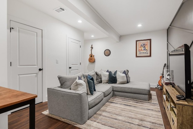 living room featuring dark wood-type flooring and beam ceiling