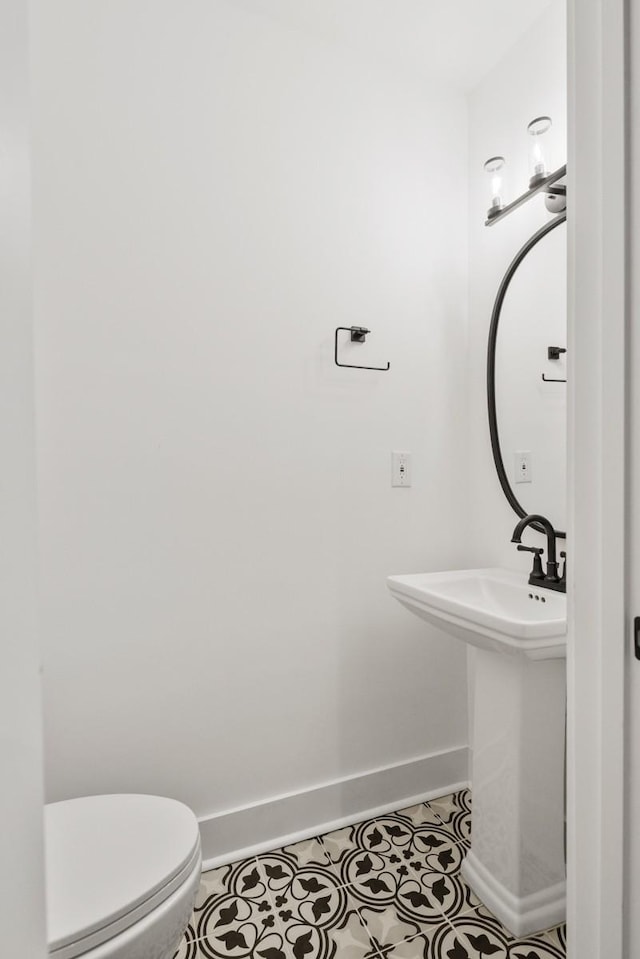 bathroom with tile patterned floors and toilet