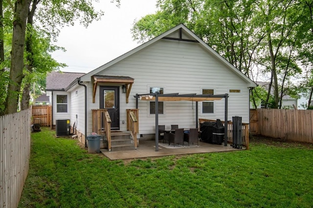 back of property featuring a patio, a lawn, and central air condition unit