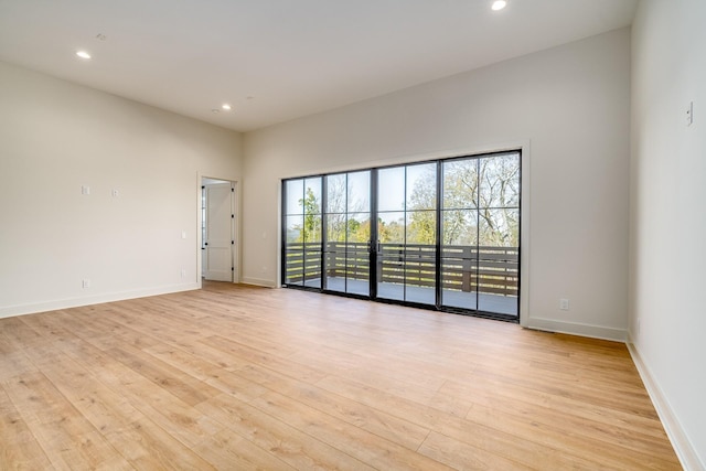 unfurnished room with light hardwood / wood-style flooring