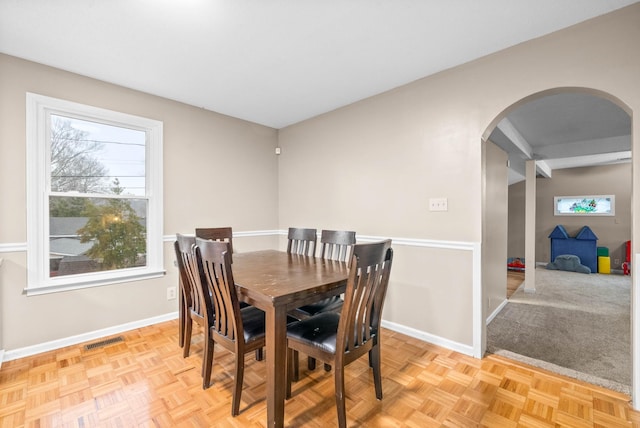 dining room featuring light parquet floors