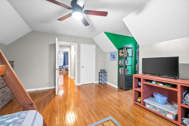 interior space with wood-type flooring, vaulted ceiling, and ceiling fan