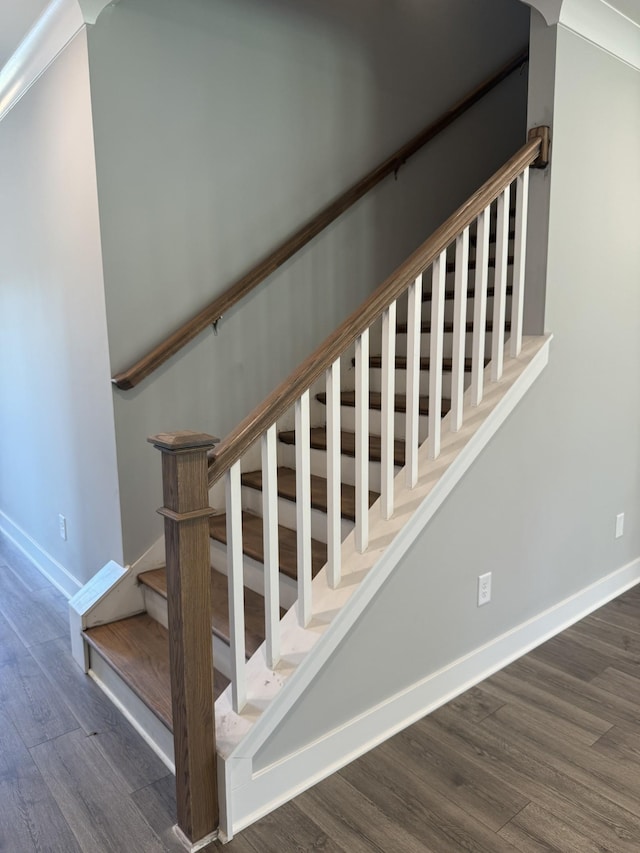 stairway featuring hardwood / wood-style flooring