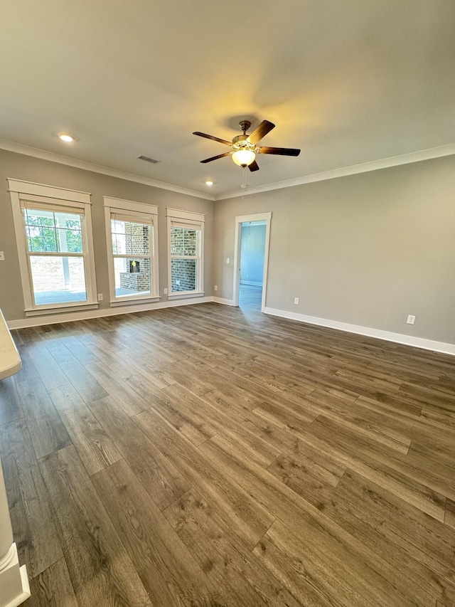 spare room with ceiling fan, ornamental molding, and hardwood / wood-style floors
