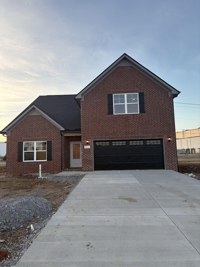 front of property with a garage