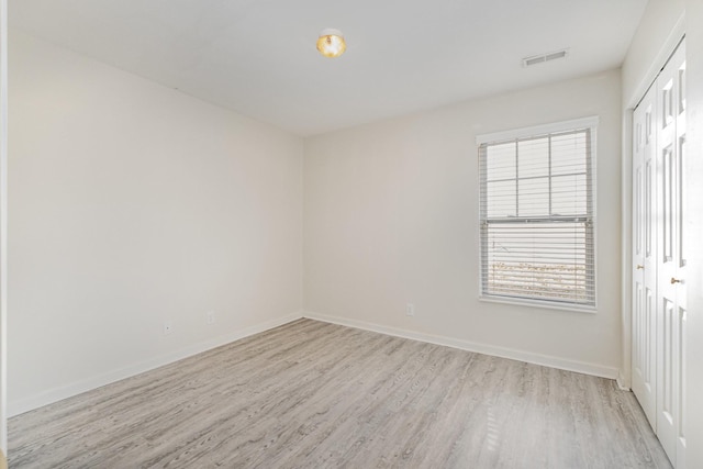 unfurnished room with light hardwood / wood-style floors