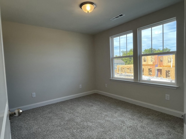 unfurnished room with carpet flooring