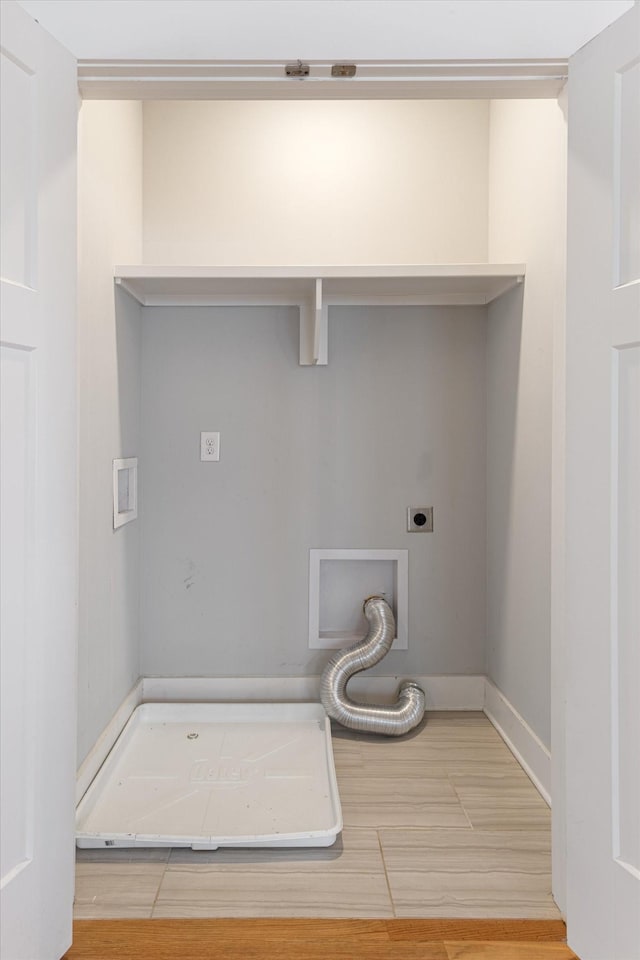 washroom featuring hookup for an electric dryer