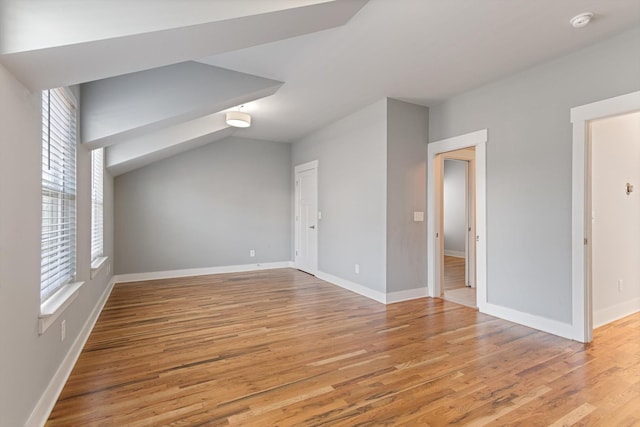 additional living space featuring light hardwood / wood-style floors