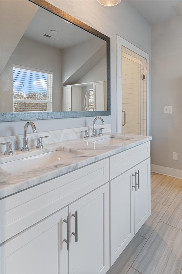 bathroom featuring vanity and hardwood / wood-style floors