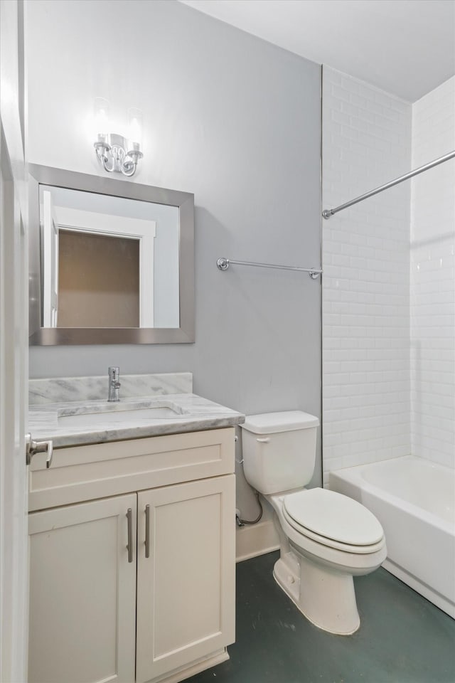 full bathroom with vanity, tiled shower / bath combo, and toilet