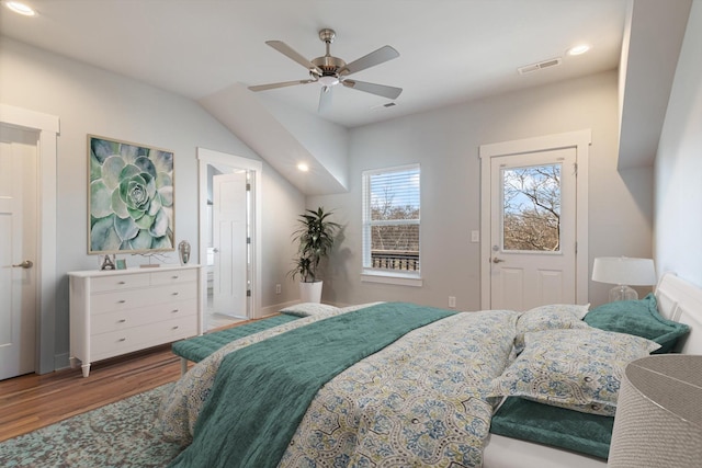 bedroom featuring connected bathroom, hardwood / wood-style flooring, and ceiling fan