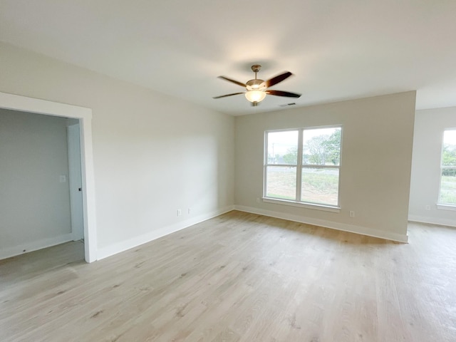 spare room with ceiling fan and light hardwood / wood-style flooring