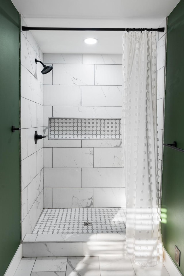 bathroom with a shower with shower curtain