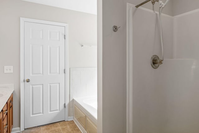 bathroom featuring vanity, a bathtub, a shower, and tile patterned floors