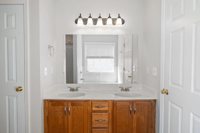 bathroom with double vanity and a sink