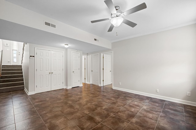 unfurnished bedroom with baseboards, visible vents, ceiling fan, and a closet