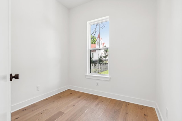 spare room featuring light hardwood / wood-style floors