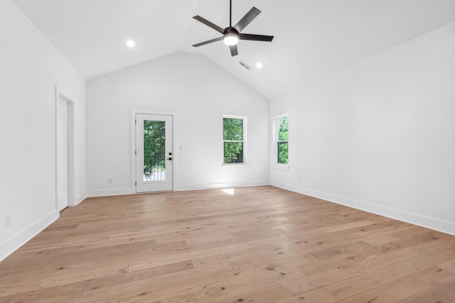 spare room featuring high vaulted ceiling, light hardwood / wood-style floors, and ceiling fan