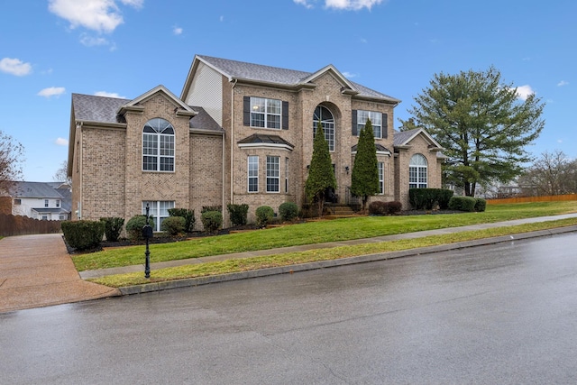 view of property with a front lawn