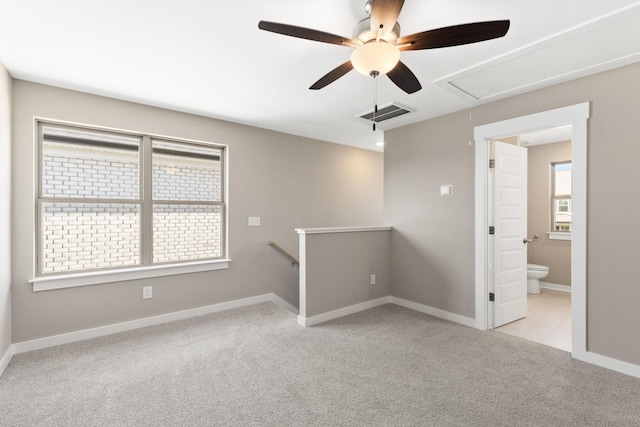 unfurnished room with light colored carpet